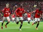 Manchester United's Kobbie Mainoo celebrates scoring their second goal with Aaron Wan-Bissaka and Alejandro Garnacho on April 7, 2024