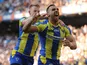 Warrington Wolves' Ryan Atkins celebrates with Chris Riley after scoring a try during the Super League against St Helens on May 25, 2013