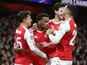Arsenal's Jurrien Timber celebrates with teammates on November 26, 2025