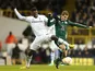 Tottenham Hotspur's Emmanuel Adebayor and Panathinaikos' Charis Mavrias battle for the ball on December 6, 2012