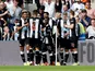 Fabian Schar celebrates scoring with Newcastle teammates on August 31, 2019