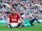 Manchester United's Robin van Persie reacts after missing a chance against Norwich on March 2, 2013