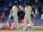 England's Joe Root and Joe Denly celebrate during the third Test against West Indies on February 11, 2019
