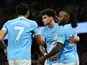 Manchester City's Nico O'Reilly celebrates with Antoine Semenyo and Omar Marmoush on February 21, 2026