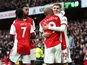 Arsenal's Emile Smith Rowe celebrates scoring their first goal with Alexandre Lacazette and teammates on February 19, 2022