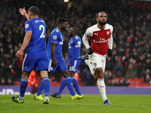 Arsenal improve to overcome Cardiff