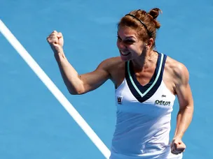 Halep fights backs to beat Lisicki