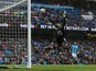 Simon Mignolet dives in vain as City score their fifth during the Premier League game between Manchester City and Liverpool on September 9, 2017