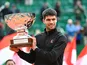 Carlos Alcaraz poses with the trophy after winning the 2025 Monte Carlo Masters