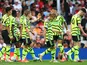 Arsenal's Leandro Trossard celebrates scoring their first goal with Ben White and teammates on May 12, 2024