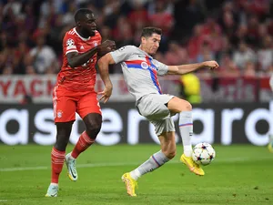 Barcelona's Robert Lewandowski in action with Bayern Munich's Dayot Upamecano on September 14, 2022