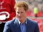 Prince Harry presents awards during the 32nd Virgin London Marathon in London on April 22, 2012