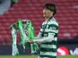 Celtic's Kyogo Furuhashi celebrates with the trophy after winning the Scottish League Cup on February 26, 2023