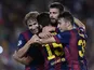 Barcelona's defender Gerard Pique celebrates with Barcelona's midfielder Sergi Samper and Barcelona's forward Munir after scoring during the UEFA Champions League football match FC Barcelona vs APOEL FC at the Camp Nou stadium in Barcelona on September 17