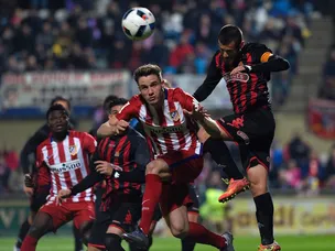 Atletico narrowly avoid cup upset at Reus