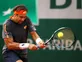 Ferrer recovers to reach third round