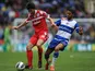 QPR's Esteban Granero shields the ball from Reading's Jobi McAnuff on April 28, 2013