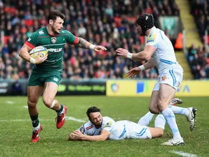 Adam Thompstone of Leicester Tigers is tackled by Phil Dollman and Matt Jess of Exeter Chiefs during the Aviva Premiership match between Leicester Tigers and Exeter Chiefs at Welford Road on March 28, 2015