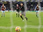 Alexis Sanchez scores from the spot during the Premier League game between Burnley and Arsenal on November 26, 2017