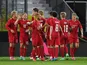 Denmark's Yussuf Poulsen celebrates scoring their first goal with teammates on June 2, 2021