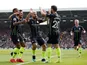 Manchester City players celebrate Bernardo Silva's goal against Fulham in the Premier League on March 30, 2019