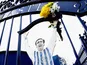 Fans pose in front of the Jeff Astle Gates before the Barclays Premier League match between West Bromwich Albion and Stoke City at The Hawthorns on May 11, 2014