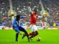 Arsenal's Theo Walcott is fouled by Wigan's Jean Beausejour in the penalty area on December 22, 2012