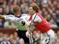 Tony Adams tussles with Les Ferdinand in 2001