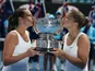 Italians Sara Errani (right) and Roberta Vinci (left) celebrate winning the women's doubles final in the Australian Open tennis championship on January 25, 2013