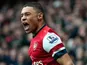 Arsenal's Alex Oxlade-Chamberlain celebrates after Norwich score an own goal and his team's third on April 13, 2013