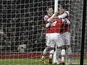 Theo Walcott is congratulated by team mates Jack Wilshere and Olivier Giroud after scoring his team's fourth goal against West Ham on January 23, 2013