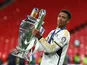 Real Madrid's Jude Bellingham celebrates with the trophy after winning the Champions League