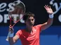 Carla Suarez Navarro waves to the crowd after winning her first round clash against Sara Errani at the Australian Open tennis championship on January 15, 2013