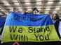 Manchester City fans display a Ukraine flag referencing Oleksandr Zinchenko inside the stadium before the match on March 1, 2022