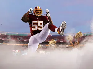 Linebacker London Fletcher #59 of the Washington Redskins is introduced before the start of a preseason game against the Pittsburgh Steelers at FedExField on August 19, 2013