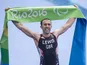 Andy Lewis celebrates winning gold in the men's triathlon at the Paralympic Games in Rio de Janeiro on September 10, 2016