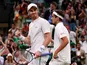 Britain's Andy Murray and France's Pierre-Hugues Herbert celebrate after winning their first round double's match against Romania's Marius Copil and France's Ugo Humbert on July 4, 2019