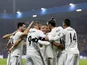 Real Madrid striker Karim Benzema celebrates with his teammates after scoring his second of the night against Viktoria Plzen on November 7, 2018