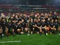 New Zealand players celebrate with the Freedom Cup trophy after winning the match in August 2022