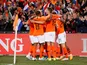 Netherlands' Memphis Depay celebrates scoring their third goal with teammates