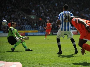 Huddersfield cruise past Millwall