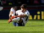 Harry Winks nurses an injured leg during the Premier League game between Tottenham Hotspur and Crystal Palace on November 5, 2017
