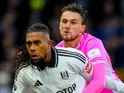 Fulham's Alex Iwobi in action with Southampton's Taylor Harwood-Bellis on December 22, 2024