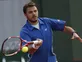Wawrinka battles into round two