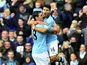 Sergio Aguero celebrates with Gareth Barry after scoring City's equaliser
