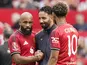 Ruben Amorim, Bryan Mbeumo and Matheus Cunha of Manchester United talking on August 9, 2025