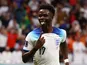 Bukayo Saka celebrates scoring for England on December 4, 2022