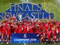 Saracens players celebrate winning the final with the trophy after the match in May 2019