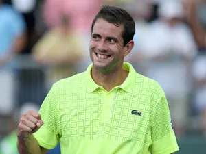 Guillermo Garcia-Lopez of Spain celebrates match point against Gael Monfils of France during their second round match on March 22, 2013