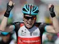 Jan Bakelants celebrates after crossing the finish line to win the second stage of the Tour de France on June 30, 2013